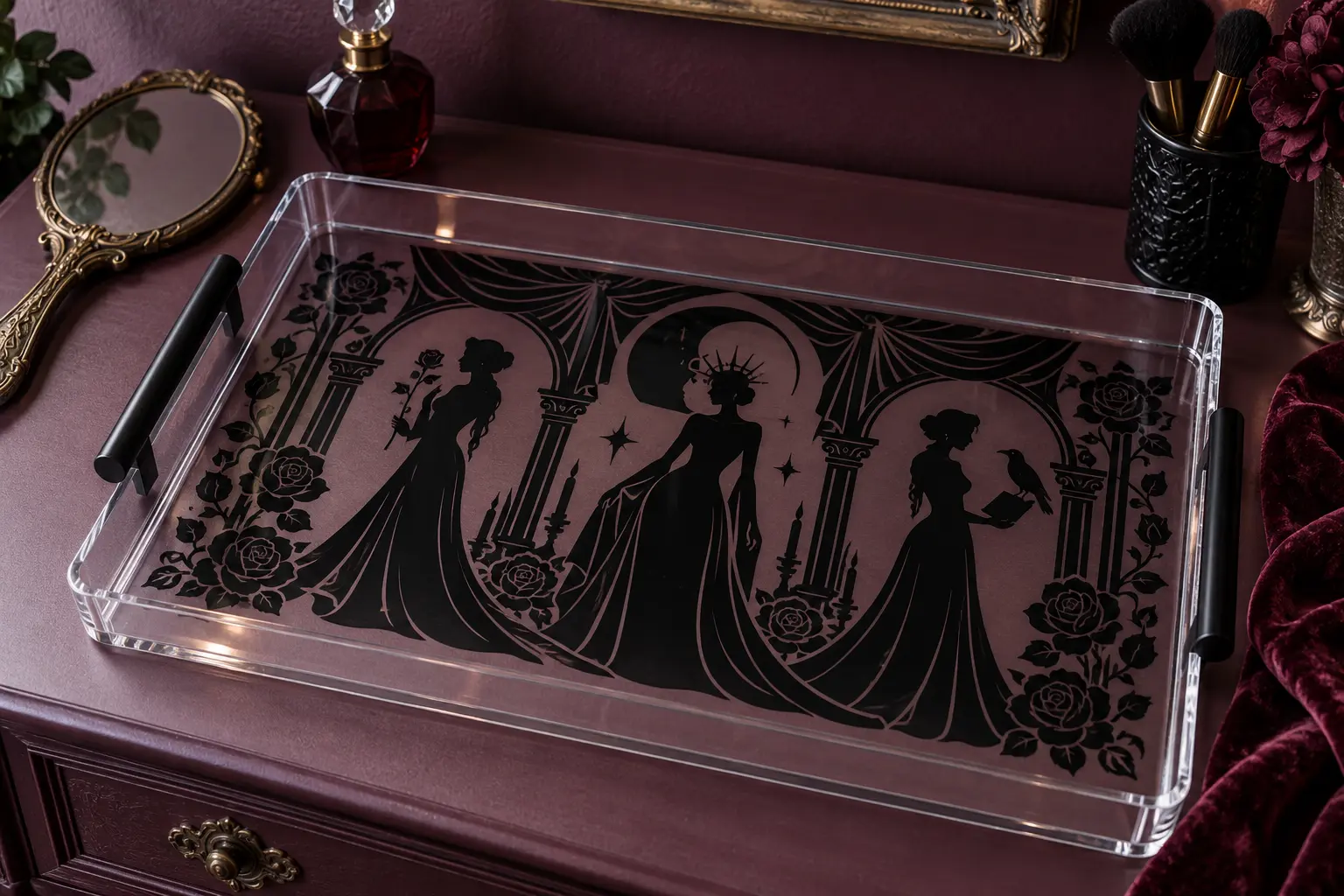 Finished clear acrylic gothic vanity tray with black reverse-applied silhouettes, arches, roses, and black side handles on a plum dressing table